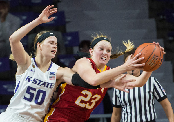 Sophomore guard Shaelyn Martin stretches to stop the ball from Pitt State senior forward Kylie Gafford. The Cats struggled to bring in a win against Pitt State with a score 58-50. (Rodney Dimick | The Collegian)